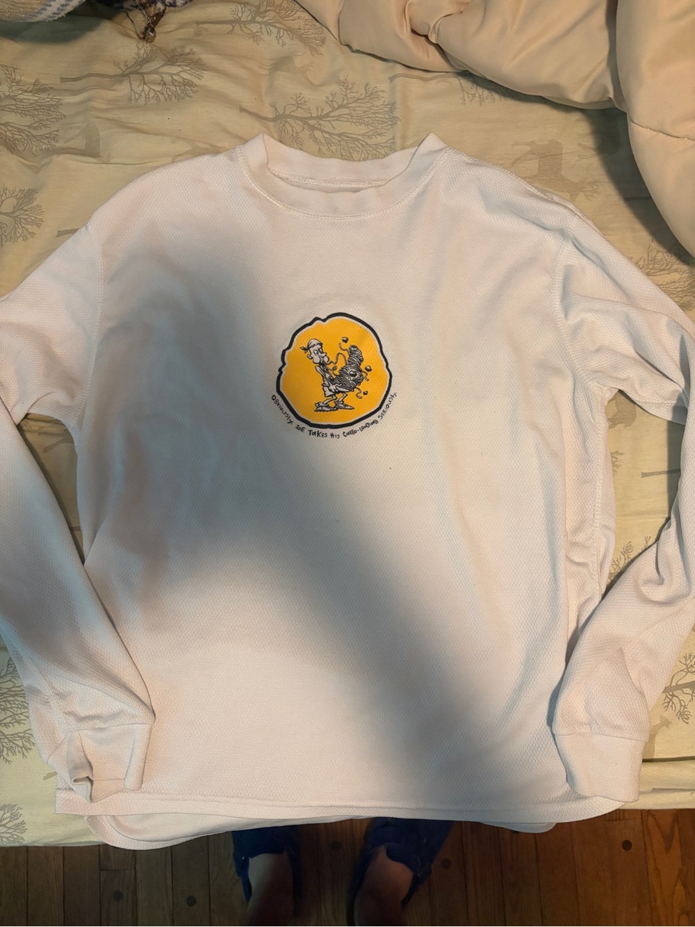 White Long Sleeve Graphic Pullover with Yellow Cartoon Patch - running